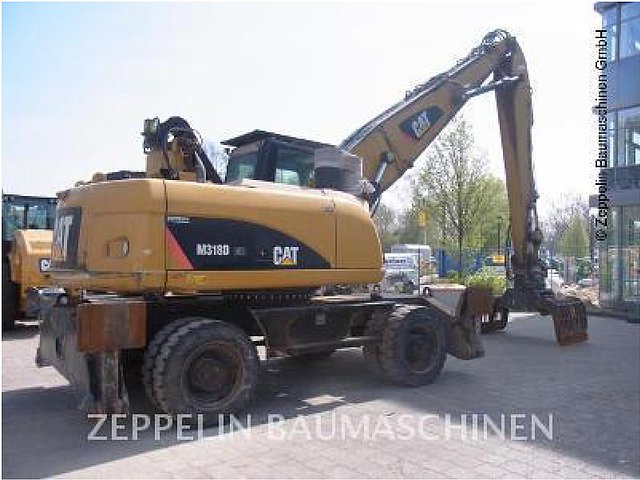 12 CATERPILLAR M318D MH